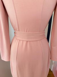 Close-up of a pink robe with a belt 