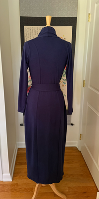 The back view of a blue long knit robe