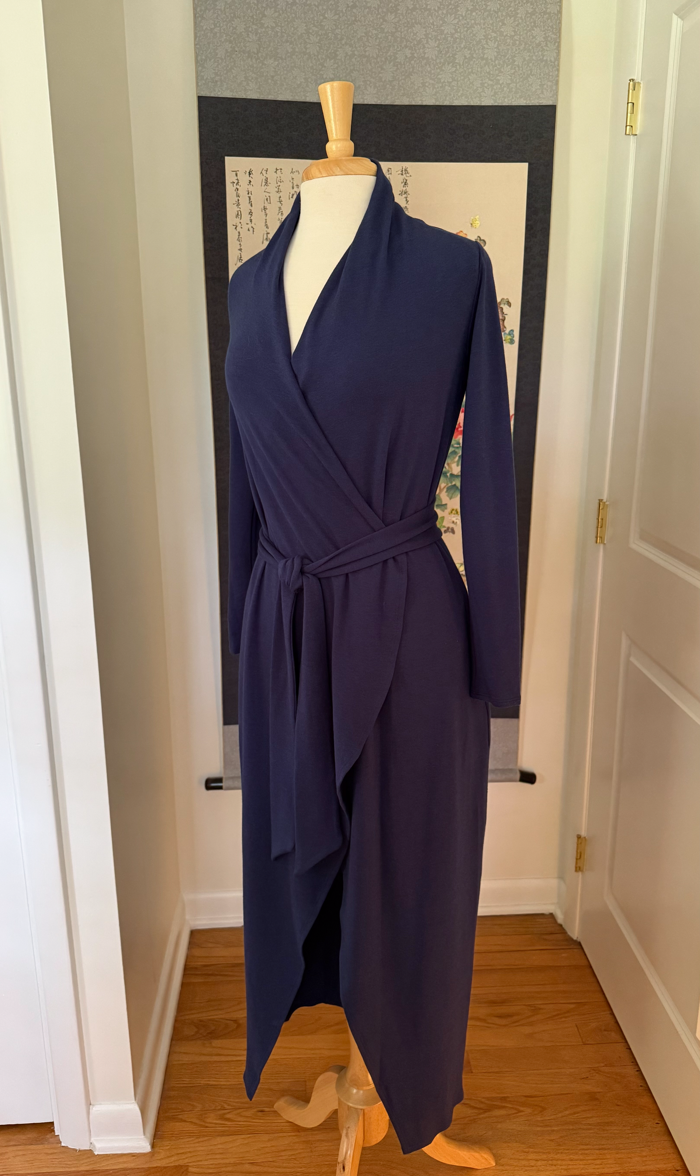 A long knit robe in blue showing front angled view
