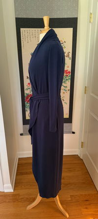 A blue long knit robe side view